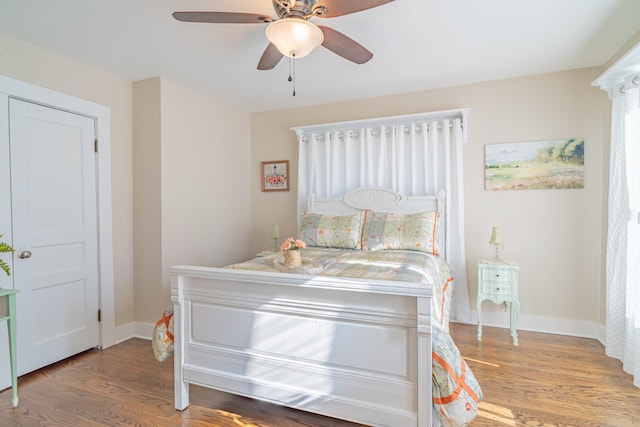 bedroom featuring ceiling fan and hardwood / wood-style floors