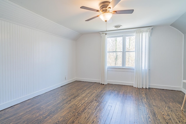 additional living space featuring ceiling fan, vaulted ceiling, and dark wood-type flooring