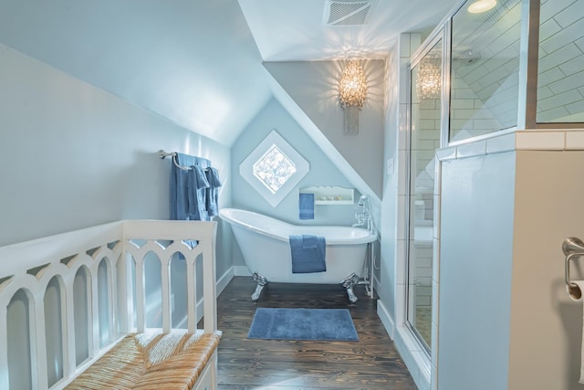 bathroom with lofted ceiling, shower with separate bathtub, a chandelier, and hardwood / wood-style flooring