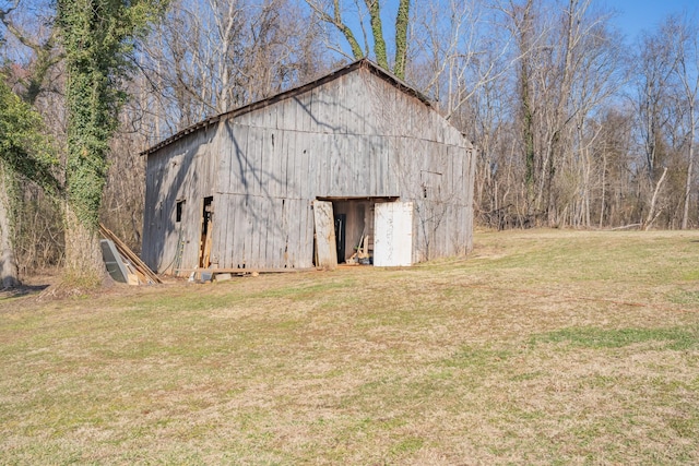 view of outbuilding featuring a yard