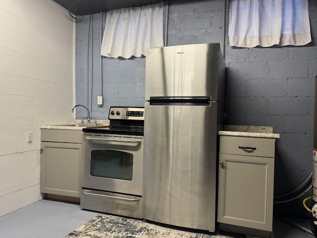 kitchen with sink, appliances with stainless steel finishes, and gray cabinetry