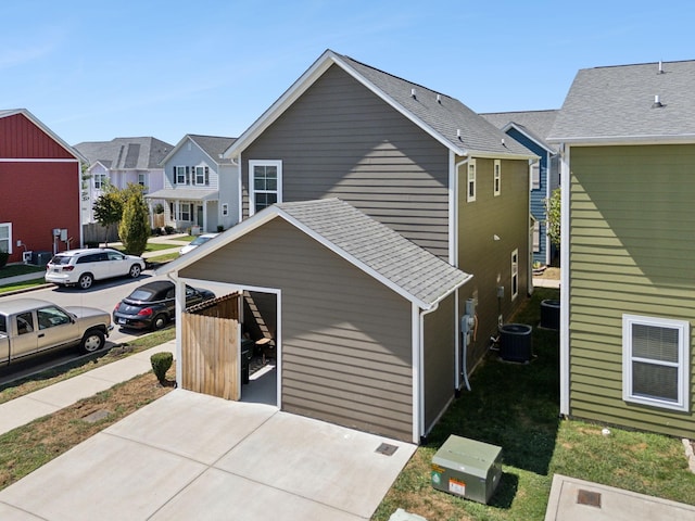 view of side of property featuring central AC