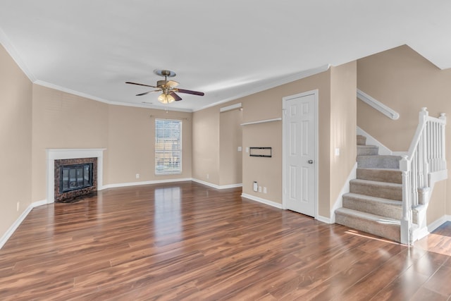 unfurnished living room featuring ceiling fan, ornamental molding, and dark hardwood / wood-style floors