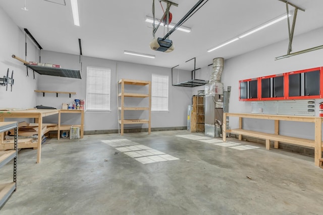 garage with a workshop area and a garage door opener