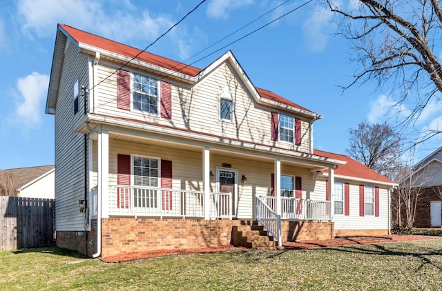 view of front of house with a porch and a front lawn