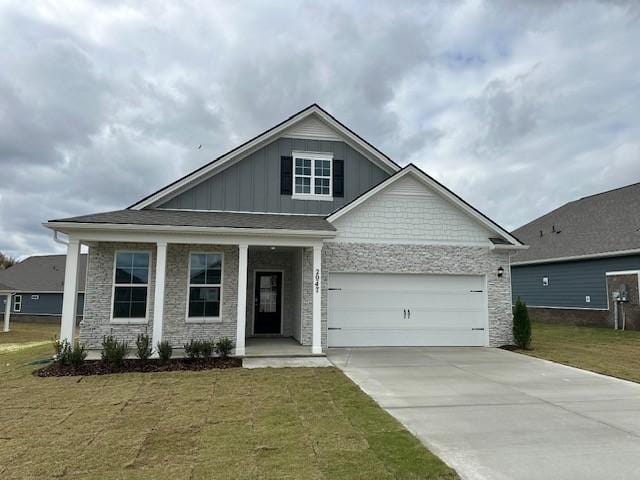 view of front facade with a garage and a front lawn