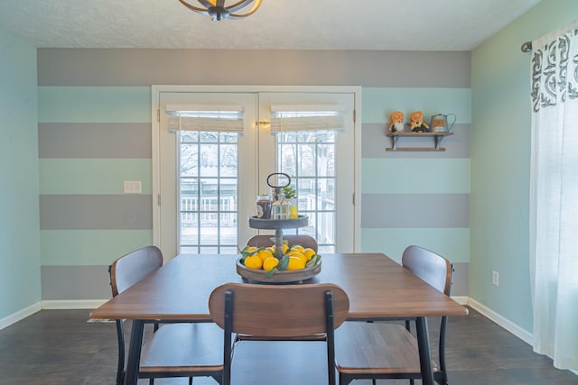 dining space with a textured ceiling