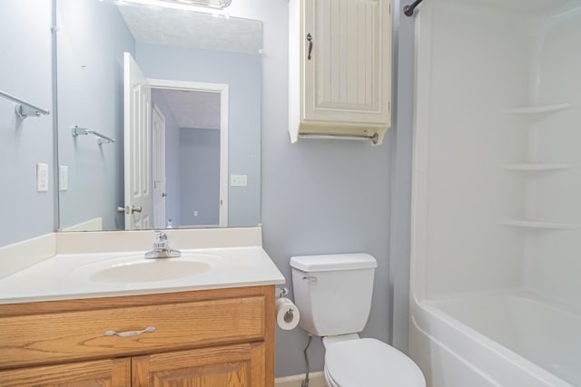 full bathroom featuring shower / tub combination, toilet, and vanity