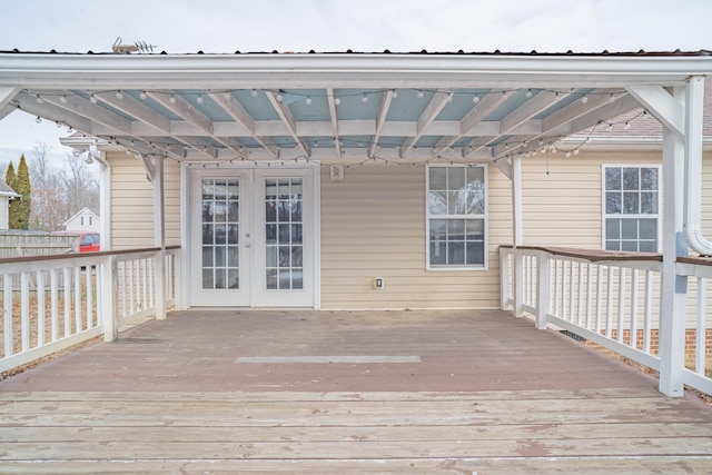 wooden deck featuring french doors