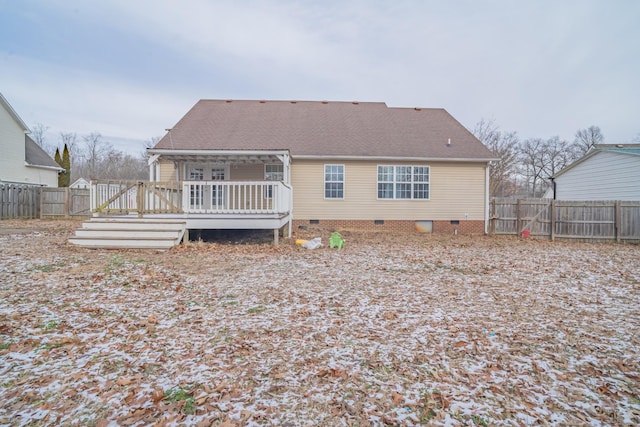 back of property with a deck