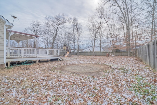 view of yard with a playground and a deck