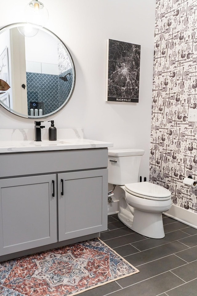 bathroom featuring vanity and toilet