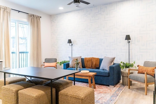 sitting room featuring ceiling fan and light hardwood / wood-style floors