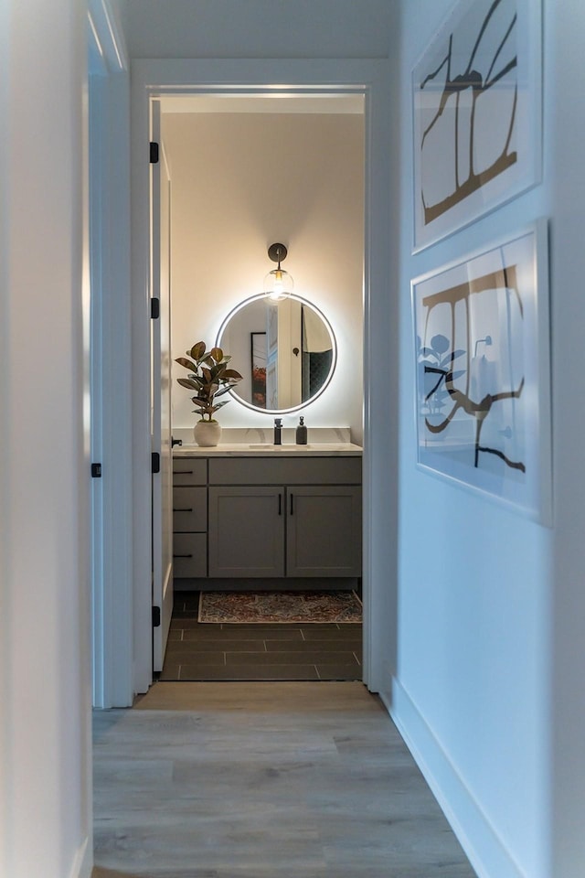 bathroom featuring vanity and hardwood / wood-style flooring