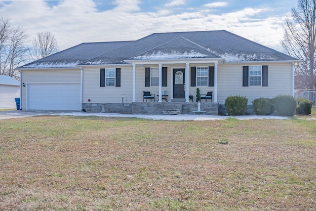 ranch-style home featuring a front yard, a garage, and a porch