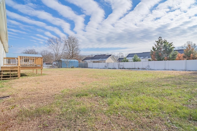 view of yard featuring a wooden deck