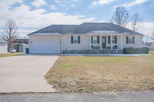 ranch-style home with a front yard, a garage, and covered porch