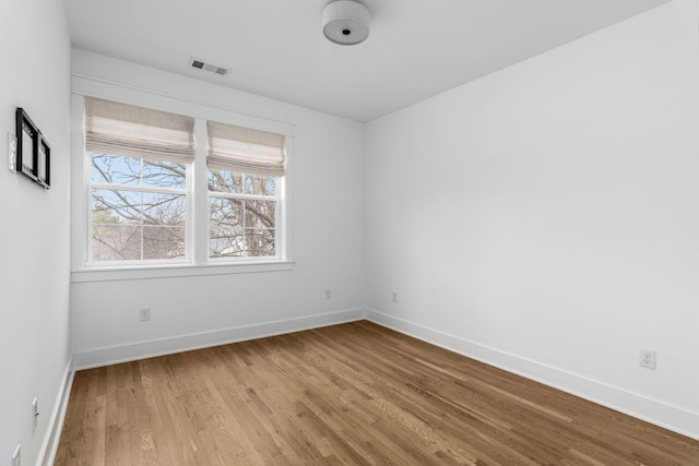 spare room with light hardwood / wood-style floors