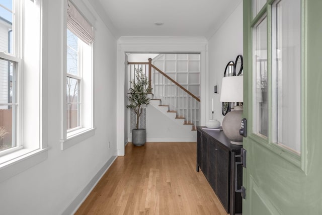 foyer with light hardwood / wood-style floors and a wealth of natural light