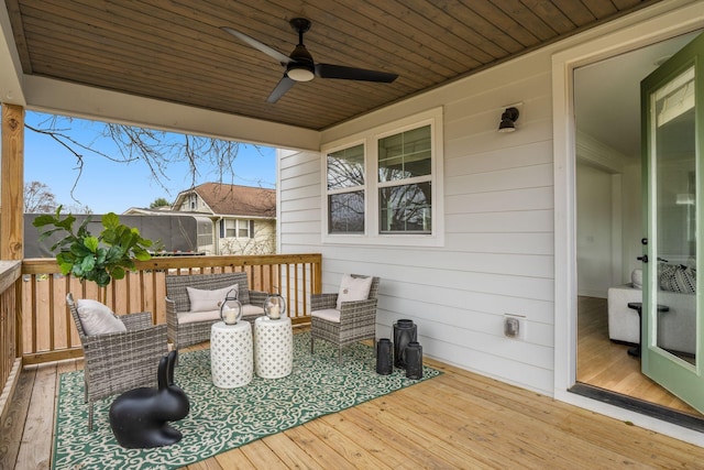 deck featuring ceiling fan and an outdoor hangout area