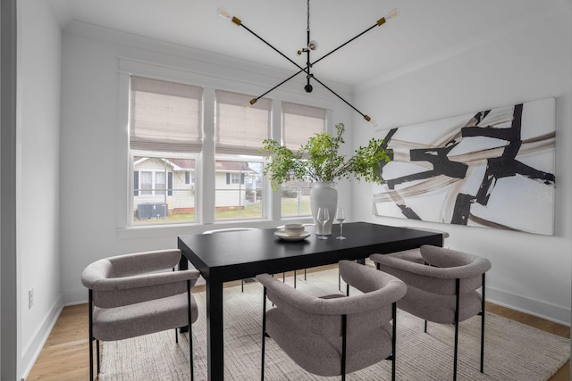 dining space featuring a notable chandelier and hardwood / wood-style floors