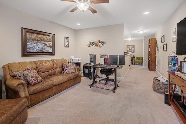 home office featuring ceiling fan and light colored carpet