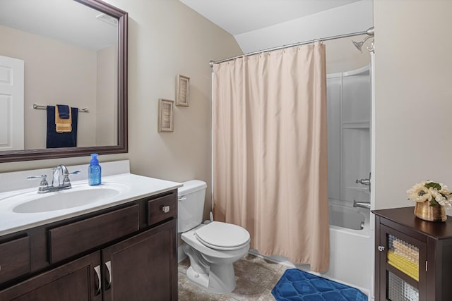 full bathroom featuring vanity, shower / bath combo with shower curtain, and toilet