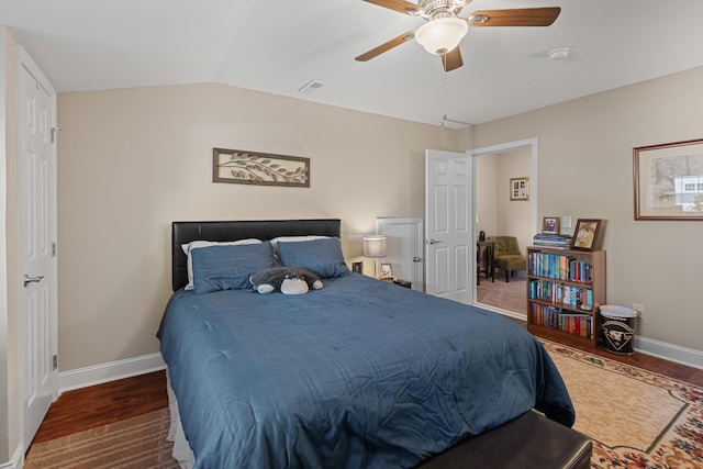 bedroom with lofted ceiling, dark wood-type flooring, and ceiling fan