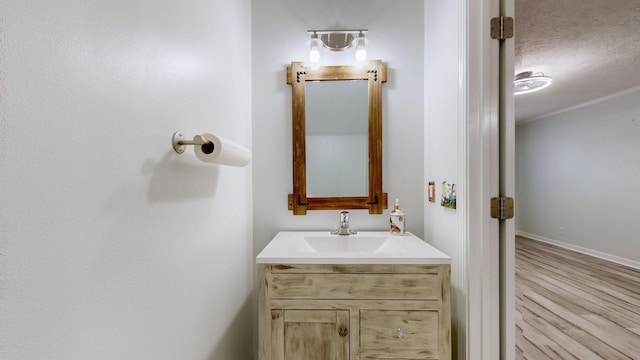 bathroom with a textured ceiling and vanity