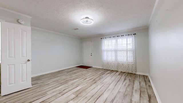 unfurnished room with light hardwood / wood-style floors, crown molding, and a textured ceiling