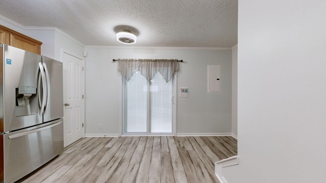 kitchen with a textured ceiling, electric panel, ornamental molding, light hardwood / wood-style floors, and stainless steel refrigerator with ice dispenser