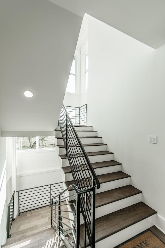 stairway featuring hardwood / wood-style flooring