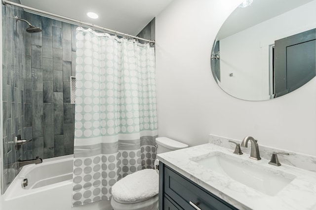 full bathroom featuring shower / bath combo, vanity, and toilet