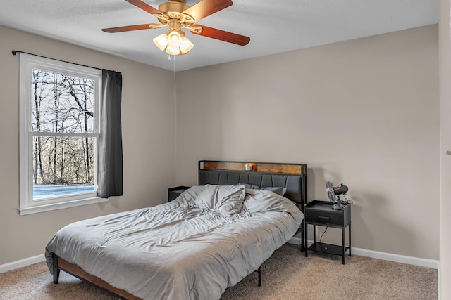 bedroom with ceiling fan and carpet