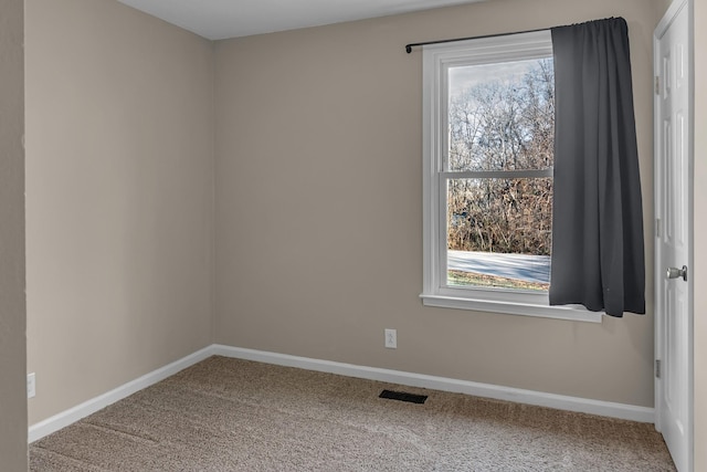 unfurnished room with carpet flooring