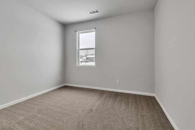 unfurnished room featuring carpet