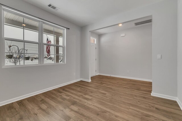 empty room featuring wood-type flooring