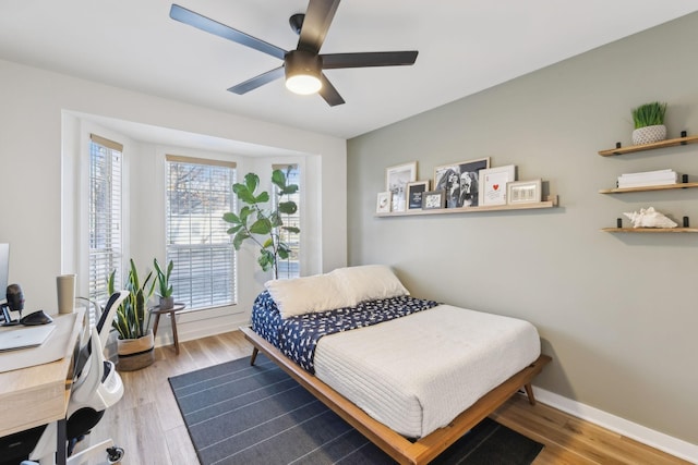 bedroom featuring ceiling fan and light hardwood / wood-style floors