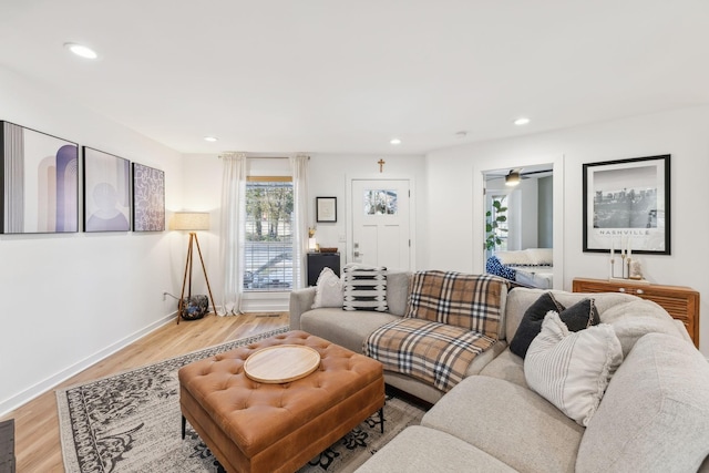 living room with light hardwood / wood-style flooring