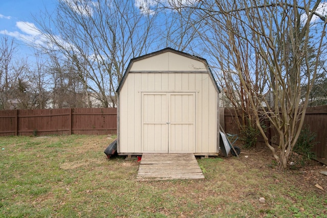 view of outbuilding with a lawn