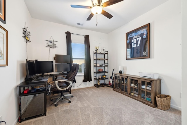 home office with carpet floors and ceiling fan