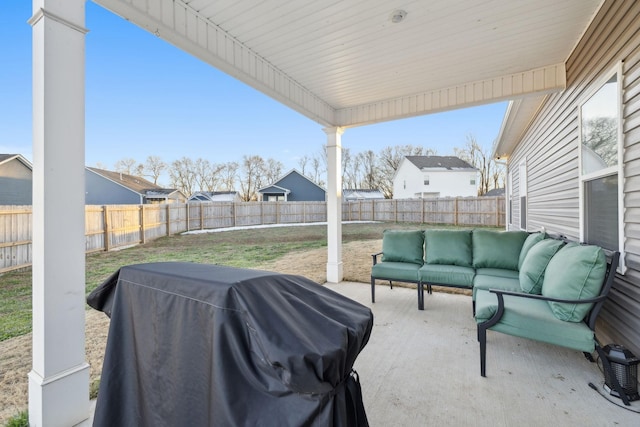 view of patio with a grill and an outdoor living space