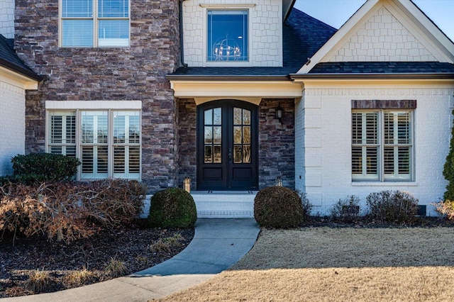 view of exterior entry featuring french doors