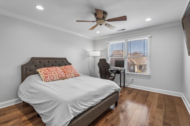 bedroom featuring ceiling fan, dark wood-type flooring, and crown molding