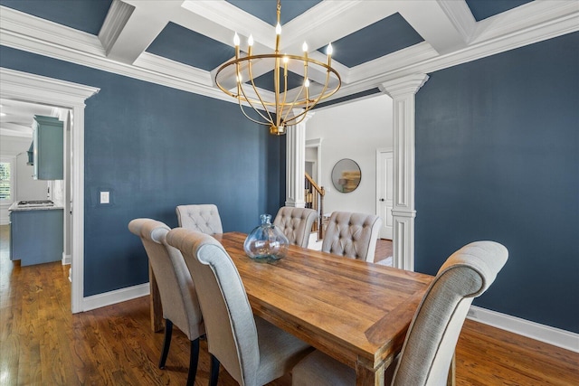 dining room with beamed ceiling, a notable chandelier, crown molding, and coffered ceiling