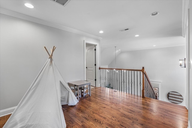 corridor featuring ornamental molding and dark hardwood / wood-style floors