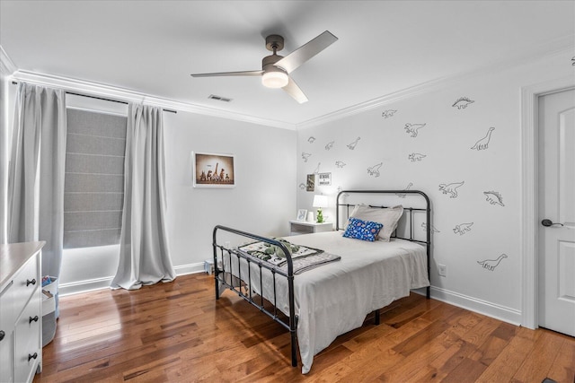 bedroom with ceiling fan, hardwood / wood-style flooring, and crown molding