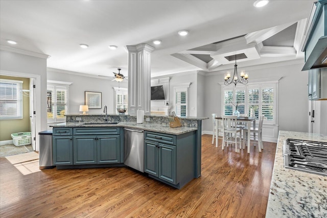 kitchen featuring ceiling fan with notable chandelier, coffered ceiling, ornamental molding, and appliances with stainless steel finishes