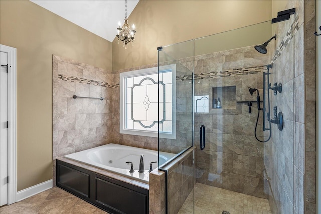 bathroom with tile patterned flooring, separate shower and tub, vaulted ceiling, and a notable chandelier