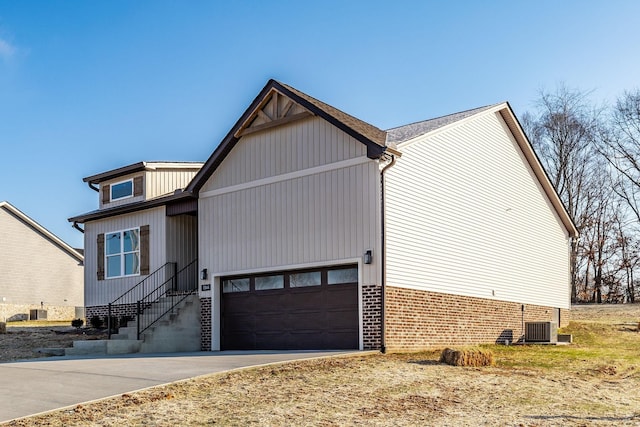 view of front facade featuring cooling unit and a garage